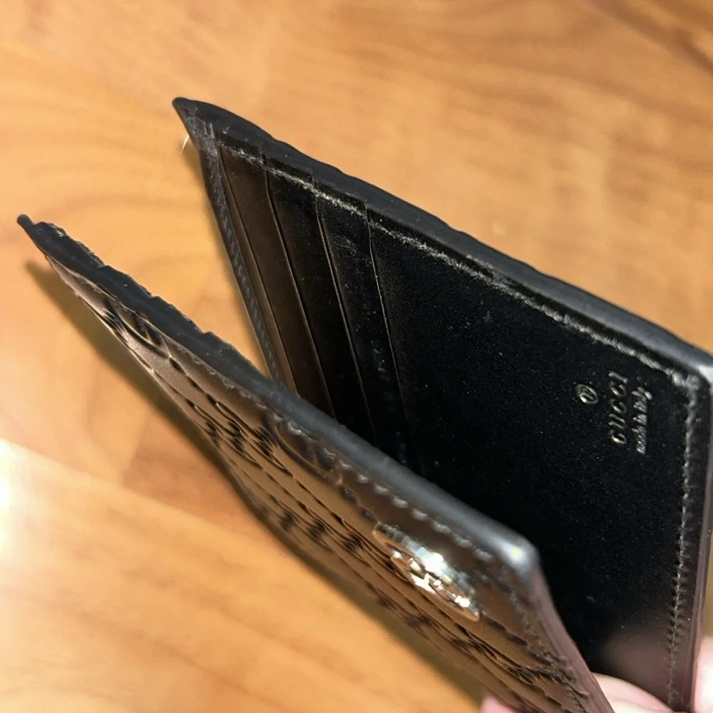 Authentic Gucci Dorian Signature Embossed Leather Bifold Wallet